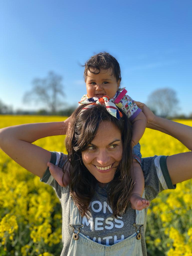 Amelia in field with Niva